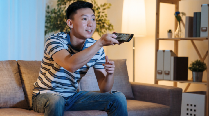 A man watching TV