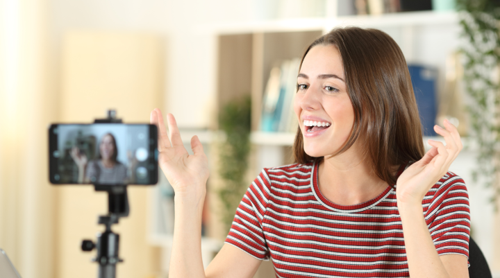 A woman talking into a video camera 