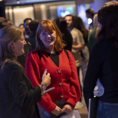 Three women engaged in conversation