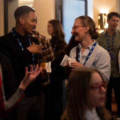Two people chatting at an event