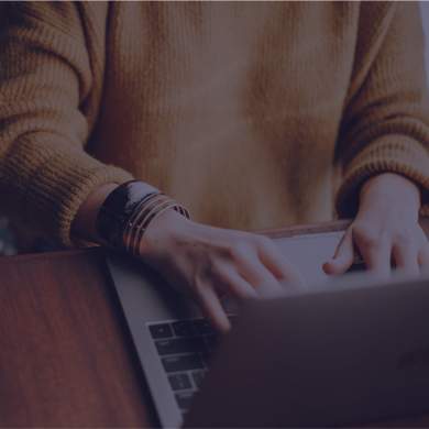 person typing at a computer